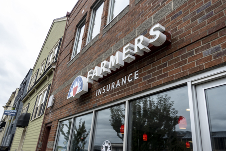 Low angle view of a Farmers Insurance building in the historic Old town Tacoma area on an overcast day. stock photo
