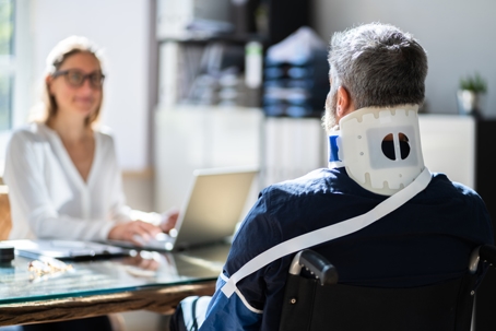 injured man meeting with an attorney in an office
