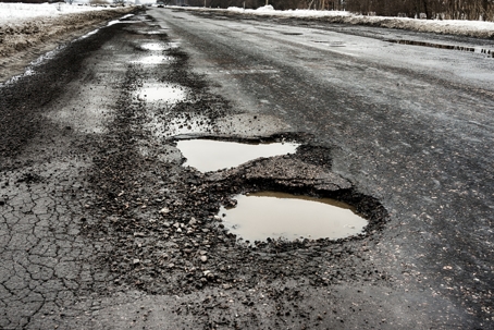 road with a pot hole