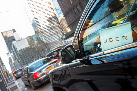 car with an uber sign in window