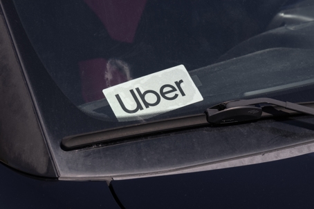 Uber Car for hire sticker. Lyft and Uber have replaced many Taxi cabs for transportation with a smart phone app. stock photo