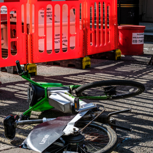 green ebike crashed and on the street